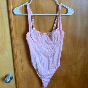 Adorable pink bodysuit out from under urban outfitters new with tags